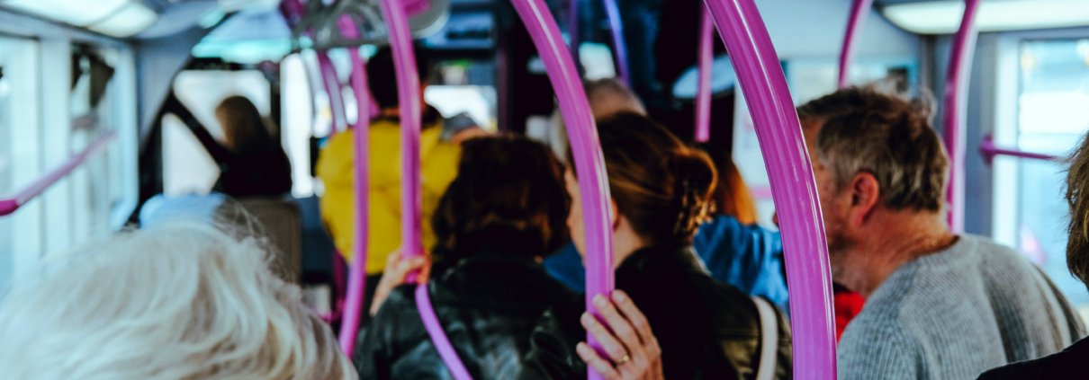 Bus passengers. Photo by Nik on Unsplash.
