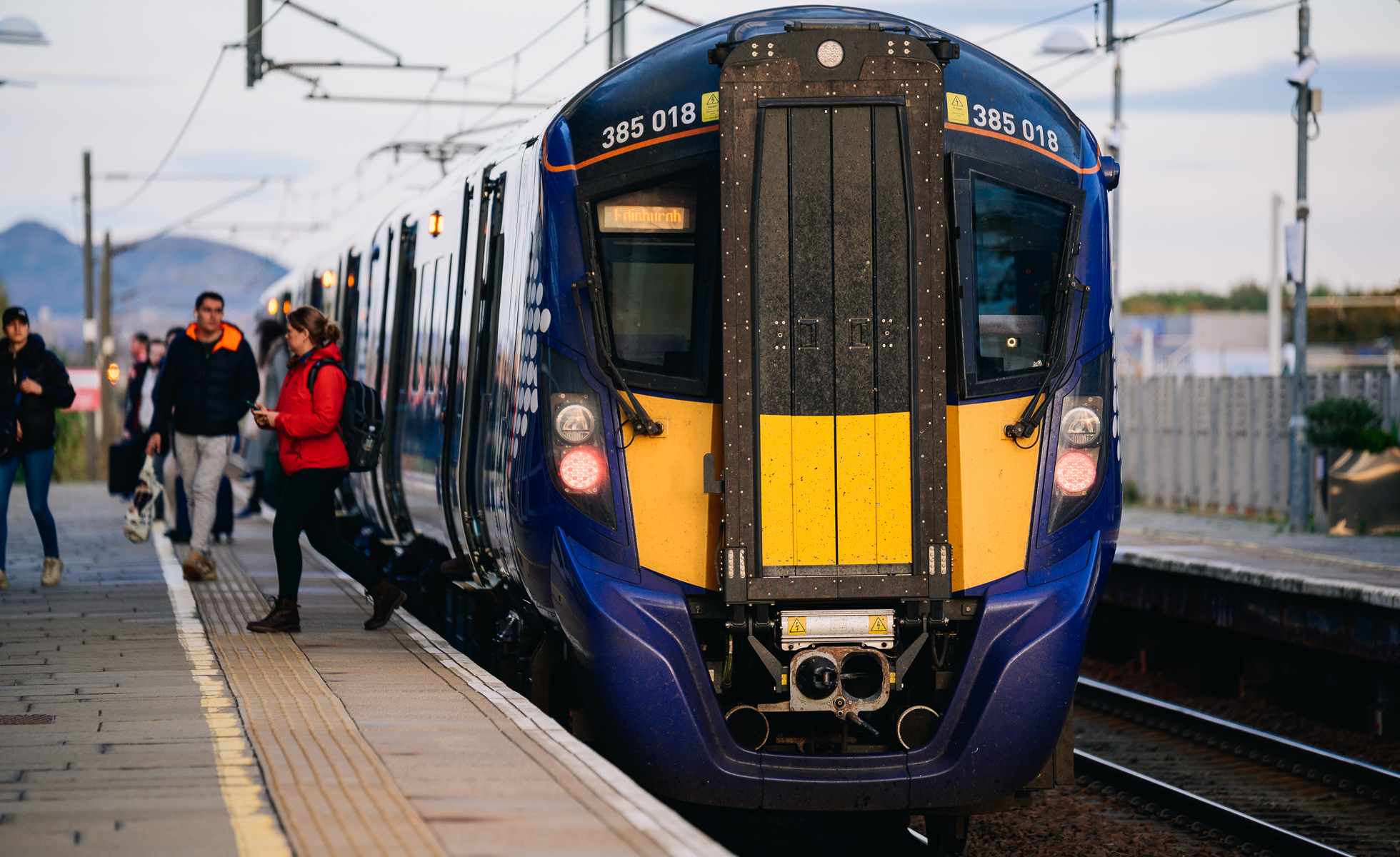 Passengers disembarking a train.