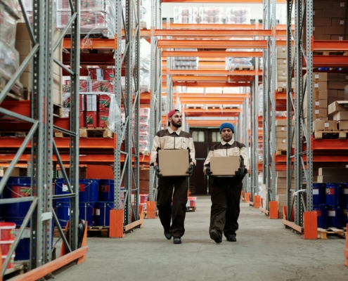 Workers in a warehouse. Photo by Tiger Lily on Pexels.
